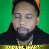 a man with a beard has his eyes closed and the words did uc snap behind him