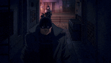 a man in a mask is walking down a hallway