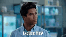 a man in a blue shirt is asking excuse me