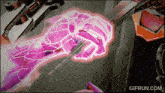 a gif from gifrun.com shows a hand with a knife in it