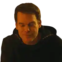 a man wearing a black hoodie is smiling with his eyes closed