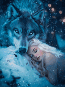 a woman is sleeping in the snow with a wolf on her chest