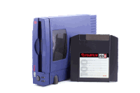 a blue fujifilm zip drive sits next to a black floppy disc