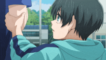 a person holding another person 's hand in a blue shirt