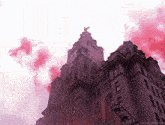 a large building with a clock on top of it and a red smoke coming out of it