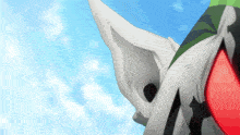 a close up of a cartoon character 's ears with a blue sky in the background