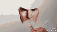 a person is drawing a man 's face with a pencil and the words made in animotica on the bottom