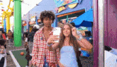 a man and a woman are taking a picture of themselves