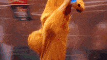 a person in a yellow jacket is holding a bottle of water