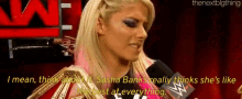 a female wrestler is talking into a microphone while wearing a wrestling ring .