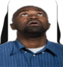 a man in a blue striped shirt looks up at the sky