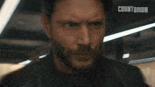 a close up of a man 's face with the words countdown written above him