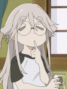 a girl with glasses is holding her finger to her lips