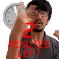 a man is pointing at a clock with the words " 2 minutes left " below him