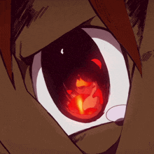 a close up of a cartoon character 's eye with a red flame coming out of it