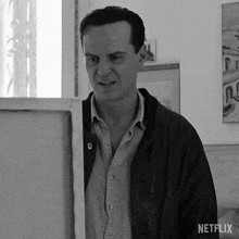 a black and white photo of a man with a netflix logo on the bottom