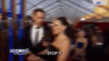 a blurry photo of a man and woman with access hollywood written on the bottom