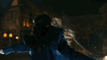 a woman with long hair is surrounded by a glowing light