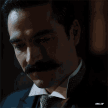 a close up of a man 's face with a mustache and the words red gif below it