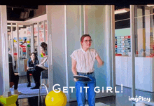 a tv screen shows a woman holding a clipboard and the words get it girl on the bottom