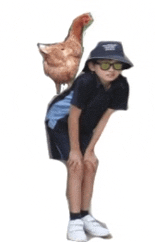 a boy with a chicken on his back wearing sunglasses and a hat