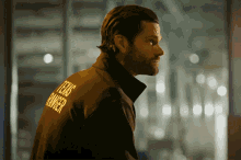 a man is wearing a jacket that says texas ranger