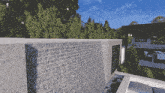 a large wall with a waterfall in the background