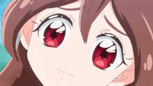 a closeup of a girl 's face with red eyes