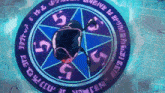 a blue and purple circle with numbers 5 and 5 on it
