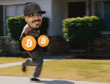 a man in a ny yankees hat is running with two bitcoins