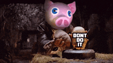 a cartoon pig holding a sign that says " dont do it "
