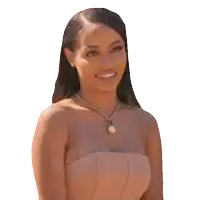 a woman wearing a strapless dress and a necklace with a pearl on it