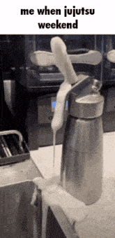 a bottle of whipped cream is sitting on a counter with the caption me when jujutsu weekend