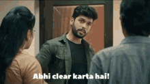 a man talking to a woman with the words abhi clear karta hai written on the bottom