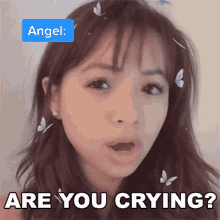 a girl with butterflies in her hair and the words are you crying