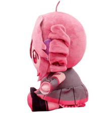 a pink stuffed animal with a purple ear and a ponytail is sitting on a white background