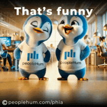 two penguins wearing peoplehum shirts are standing next to each other in an office