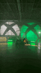 a green x is projected on the ceiling of a room