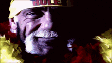 a close up of a man wearing a hat that says rules on it