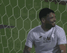 a soccer player wearing a shirt that says 1/2 million on it