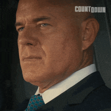 a close up of a man 's face with the word countdown on the bottom right