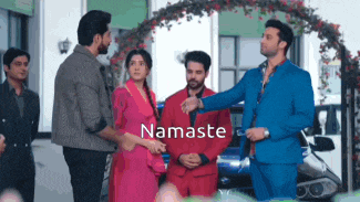 a group of people standing in front of a car with the word namaste written on the bottom