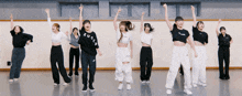 a group of young women are dancing in a room and one of them has a shirt that says zu club