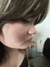 a close up of a woman 's face with red spots