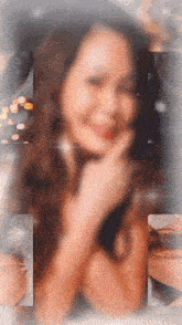 a blurry picture of a woman 's face with a crown on her head