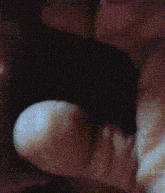 a close up of a person 's mouth with a pixelated background