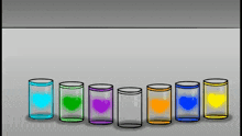 a row of shot glasses with hearts on them in different colors