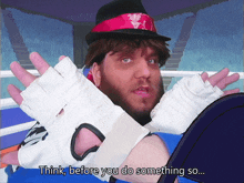 a man in a boxing ring says " think before you do something so ... "