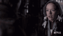 a blurred image of a woman with netflix written on the bottom