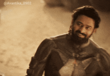 a man with a beard is smiling in a sepia tone photo with the hashtag avantika0902